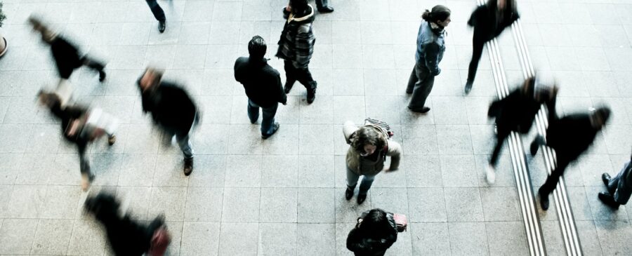 people walking on grey concrete floor during daytime